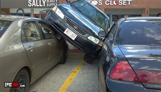 car-between-cars-ontop-of-one-on-side