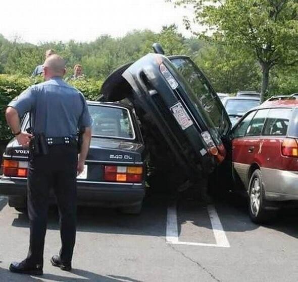 car-on-side-inbetween-to-cars-in-parking-bay