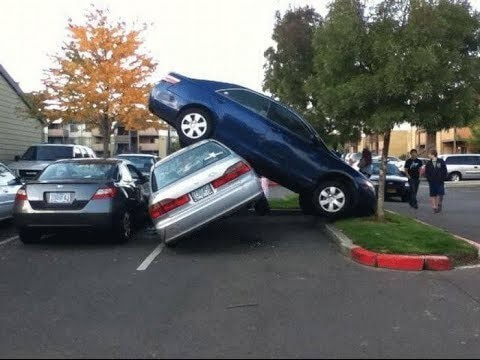 car-ontop-of-car-on-side-walk