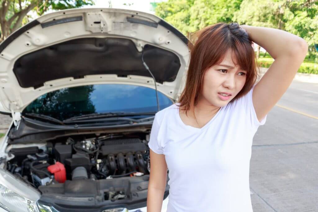 woman-stressed-broken-down-car